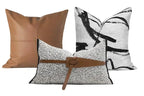 Three decorative pillows with different patterns and colors on a white background, featuring the Wild House brand.